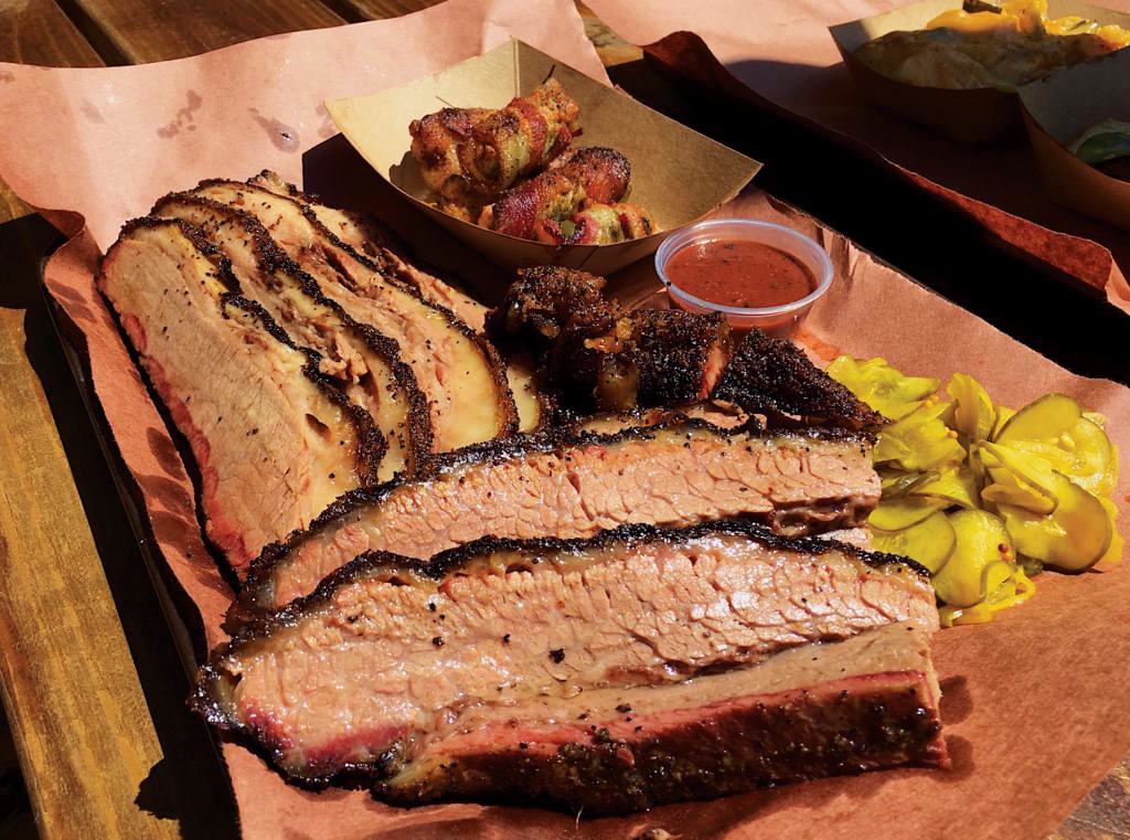 LeRoy and Lewis Barbecue signature dishes Smoked Beef Cheeks, Barbacoa, and house-made sausages.